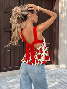 SHEIN PariChic Áo croptop ngắn không dây vai màu đỏ họa tiết hoa dành cho nữ, kiểu dáng mùa xuân hè, có dây buộc phía sau, thiết kế hở lưng, được làm từ vải hoa nền trắng, với dây đeo bản rộng màu đỏ và thiết kế xếp ly ở eo, phong cách tươi mới phù hợp cho các buổi hẹn hò mùa xuân hè và các dịp thường ngày. Đặc điểm sản phẩm bao gồm: Áo croptop không dây vai họa tiết hoa dành cho nữ, áo croptop trang trí thắt lưng đỏ, áo xếp ly ở eo, áo kiểu dáng tươi mới mùa xuân hè, áo kiểu dáng thường ngày đa năng. - Nhiều màu - Xem 5