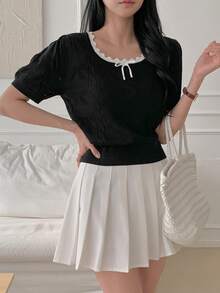 DAZY Áo dệt kim tay ngắn phối màu tương phản cổ nơ dành cho nữ, chất liệu thêu họa tiết. - màu đen - Xem 4