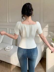 Celisse Áo sơ mi nữ kiểu Pháp thanh lịch, màu trơn, cổ bèo, tay ngắn, cài một hàng khuy, dáng ôm, phù hợp cho công sở và đi làm. - Màu be - Xem 2