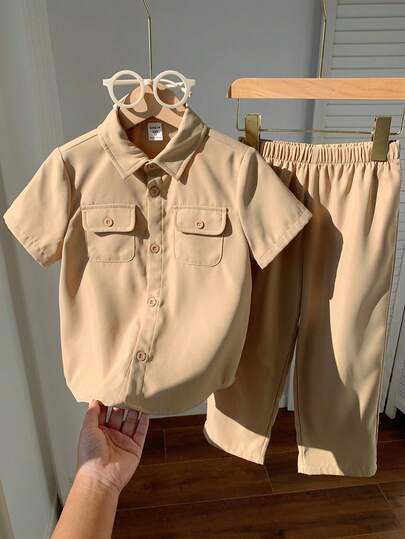 SHEIN 2pcs Boys Casual Solid Color Chest Pocket Short Sleeve Shirt And Elastic Waist Pants Set, Suitable For Autumn, Spring, Summer, Suitable For Outdoor Play, School, Street Photography, Party And Leisure