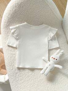Cozy Pixies Baby Girl Solid Color Knit Soft Round Neck Ruffle Trim Short Sleeve Pullover Top Baby Girl White Tops Puffed Sleeve Baby Outfit Toddler Ruffle Sleeved Tops Baby Clothes Girl Flounce Sleeve Toddler White Top Baby Tops Girl Elegant Tops For Toddler Girls Baby T Shirts Girls Cotton - White - View 2
