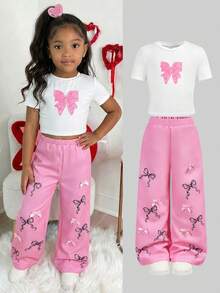 2 Stücke/Set Kleine Mädchen Weißes T-Shirt mit Schleifen Muster & Rosa Blumen Muster Hose, Lässig, Modisch, Vielseitig, geeignet für Ausflüge, Schwester Fotoshootings, Parkbesuche, Camping, Urlaub, Alltags Lässig Tragen - Verschiedenfarbig - Übersicht 1