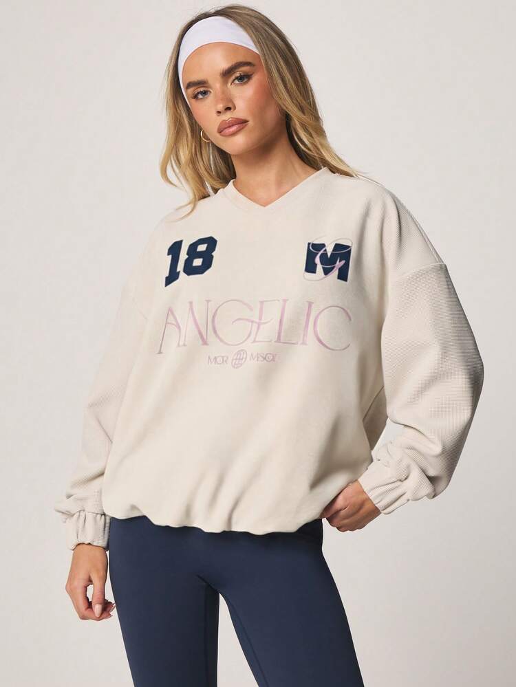 MISSGUIDED Damska bluza z długim rękawem i dekoltem w serek, teksturowanym wzorem waflowym, oversize'owym, z anielską grafiką Varsity