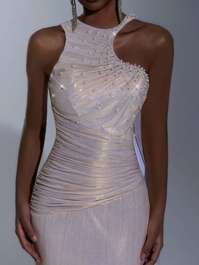 Elitara Elegant, Glamorous, Stylish, And Captivating. Light Champagne Gold Stretch-Coated Textured Fabric With Pearl Embellishments. Features A Round Neck, Asymmetrical Design, Flowing Sleeves, A Fishtail Hem, And Train. Suitable For All Wedding Guests, Formal Occasions, And Elaborate Gowns.