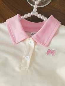 女嬰甜美粉色夏季休閒套裝 Polo領短袖T恤搭配蝴蝶結刺繡泡泡袖上衣&荷葉邊下擺短褲 奶油色 2件組 - 杏色 - 查看 4