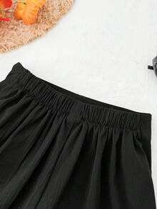 SHEIN Pantalón corto de falda de niña preadolescente de unicolor con textura tejida, informal para primavera/verano - Negro - Ver 5