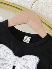 SHEIN 2件套女婴可爱针织蝴蝶结装饰短袖上衣和短裤套装 蝴蝶结女婴服装裙装套装 女婴裙子套装 女婴夏季服装套装 - 黑色 - 查看 6