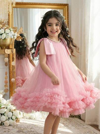 Vestido lindo de unicolor con decoración de lazo en los hombros y malla sin mangas para niña joven