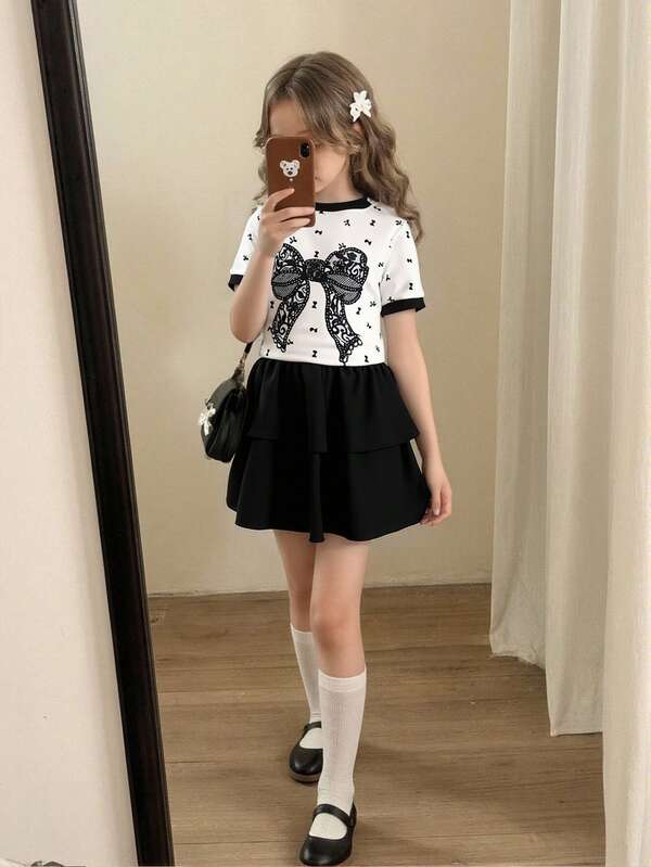 Girls (Small) Spring/Summer T-Shirt Set, Black Lace Bow Digital Print Pattern, White Spliced Black Short Sleeve Round Neck T-Shirt Top Paired With Black Solid Color Double-Layer Cake Skirt, 2pcs Set, Suitable For Girls' Daily Simple, Casual, Elegant, Commuting Wear, Suitable For Daily School, Outings, Vacations, Parties, Holidays, Spring/Summer Vest Skirt Two Piece Elegant Set For Girls Girls Skirt And T Shirt Kids Short Dress For Girls Kid Shirt With Skirt Girls Skirt Set Girls Two Piece Set Fa