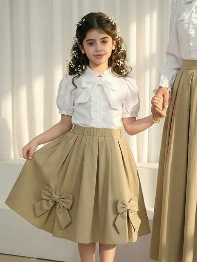 一款适合女孩的大号领结，搭配一件短袖休闲时尚衬衫，适合夏季日常和节日穿着。