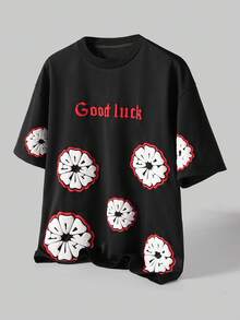 Manfinity Hypemode Camiseta de manga corta casual de cuello redondo con gráfico de letras y flores para hombres - Negro - Ver 1