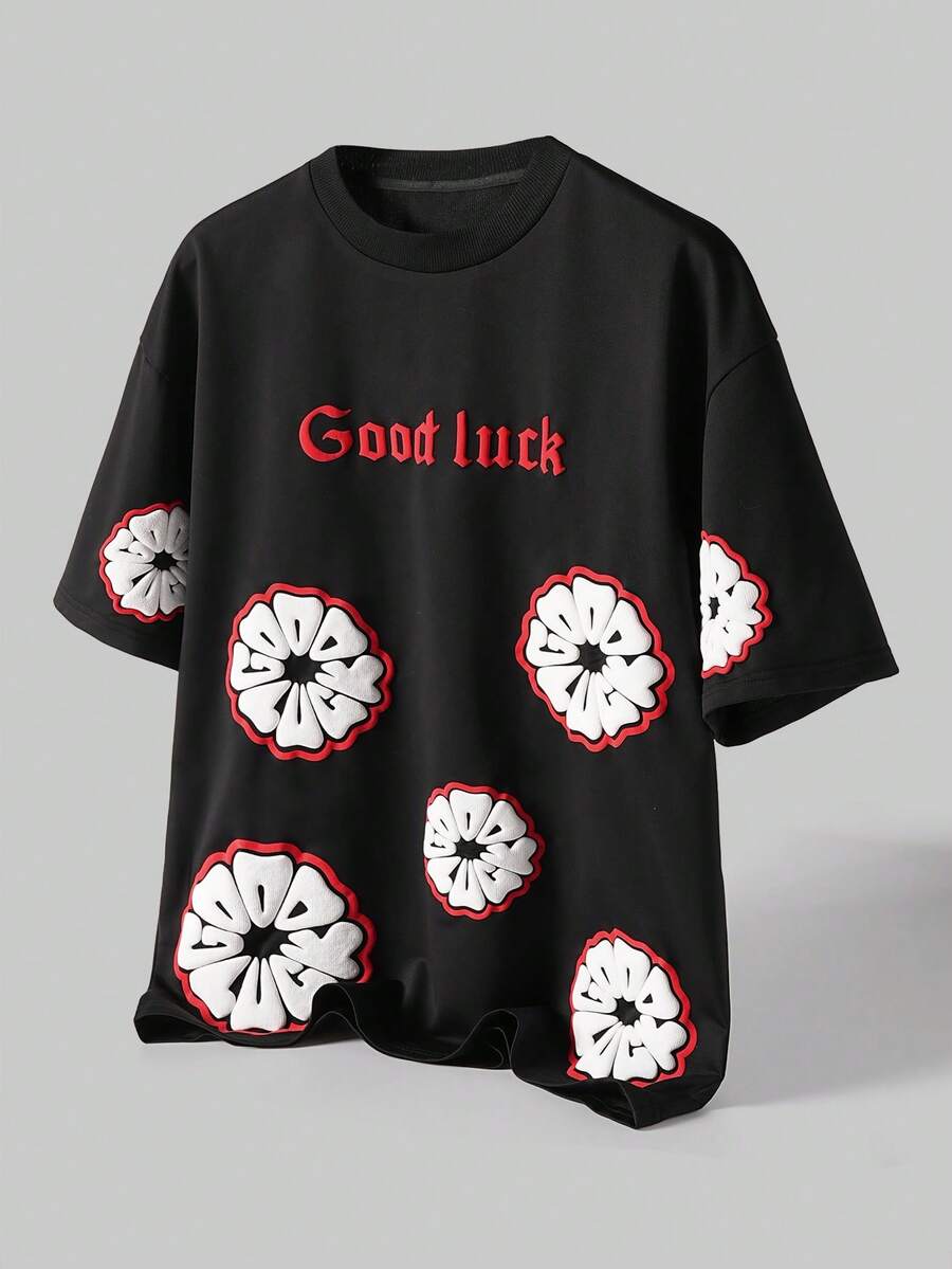 Manfinity Hypemode Camiseta de manga corta casual de cuello redondo con gráfico de letras y flores para hombres - Negro - Ver 1