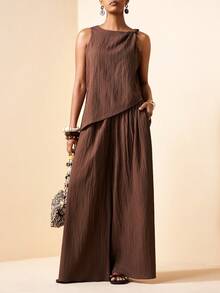 Zivah Bộ đồ hai mảnh màu nâu mới cho mùa Xuân/Hè 2026, gồm áo kiểu dáng rộng rãi, chất liệu vải có họa tiết, thắt nút ở vai và quần ống rộng cạp cao. Thích hợp cho mặc hàng ngày, đi nghỉ mát, phong cách boho, đi biển, dự tiệc, trang phục dự đám cưới, trang phục sân bay, mặc đi ăn trưa, đi làm, du lịch, kỳ nghỉ, trà chiều và mua sắm. - màu nâu - Xem 6