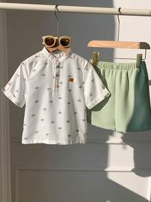 SHEIN 2pcs/Set Young Boy Cartoon Coconut Tree Pattern Mandarin Collar Short Sleeve Half-Zip Pullover Top And Elastic Waist Solid Color Shorts,Kids - White - View 7