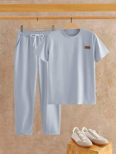 HIMLAND Men's Casual Everyday Commute Versatile Letter Graphic Decor Short Sleeve T-Shirt And Drawstring Waist Long Pants Set, Spring/Summer/Autumn