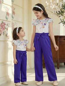 SHEIN Tween Girls' Casual Floral Print Round Neck Cap Sleeve Shirt Top And Straight Waist Paper Bag Pants 2-Piece Coordinating Set, Purple