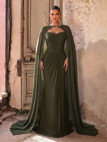 Aureia Elegant, Stylish, And Captivating Military Green Stretch Knit Chiffon Dress With A Round Neck And Rhinestone Chain Embellishments. Strapless Bodice, All-Over Pleats, A-Line Silhouette, And Flowing Shawl. Suitable For All Formal Occasions. A Sophisticated Evening Gown.