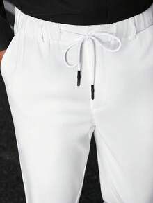 Manfinity Bizformal Quần tây nam công sở tối giản, màu trơn, cạp chun, túi xéo, chất liệu vải chống nhăn, nhanh chóng trở lại trạng thái phẳng mịn sau khi mặc hoặc giặt, giảm thiểu nhu cầu ủi bằng tay. - trắng - Xem 6