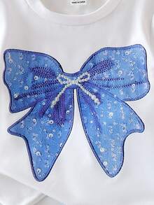 SHEIN Playful Pals Baby Girls' Cute Oversized Bow Print Short Sleeve Round Neck White Top Paired With Blue Shorts,Casual Minimalist Summer T-Shirt Set Vacation Outfits - White - View 6