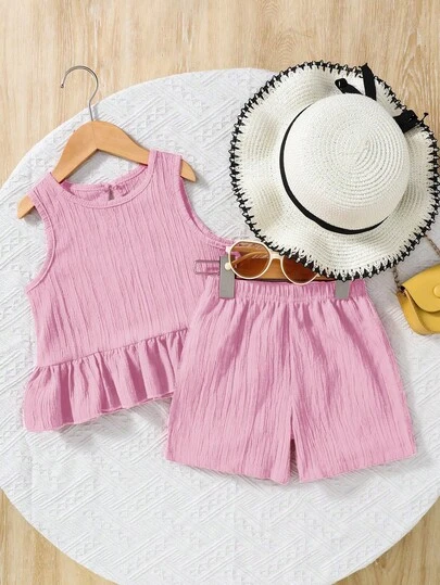 SHEIN Elladie kids 2pcs/Set Young Girl Woven Pink Textured Fabric Sleeveless Top And Loose Shorts. Woven Craftsmanship Creates A Delicate, Soft Feel For Comfortable, Refreshing Wear. The Simple, Elegant Top Showcases A Sweet Elegant, While The Loose-Cut Shorts Allow Free Movement, Suitable For Summer Casual Or Outdoor Activities. The Overall Soft, Pastel Color Palette Exudes Youthful Vitality, Making It An Ideal Summer Wardrobe Choice For Little Girls.