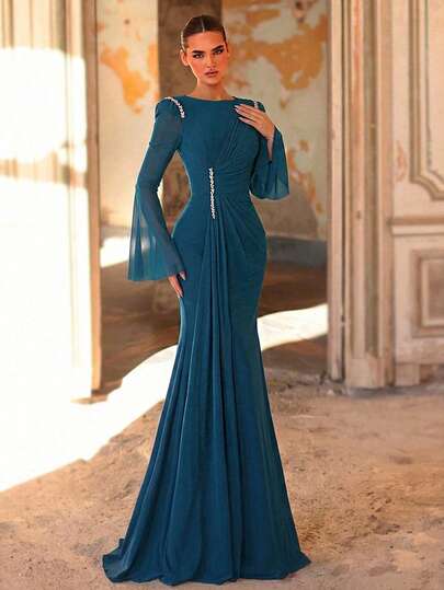 Aureia Elegant And Romantic Peacock Blue Round Neck Sheer Flared Long Sleeves, High-Elastic Knit Mesh, Luxurious Three-Dimensional Rhinestone Embellishments, Fishtail Train. Suitable For All Formal Occasions, Including Dates, Wedding Parties, Luxury Evening Gowns, Ladies' Wedding Guests, Bachelorette Parties, New Year's Outfits, Dates, And All Formal Occasions. A Perfect Evening Gown For Ladies.