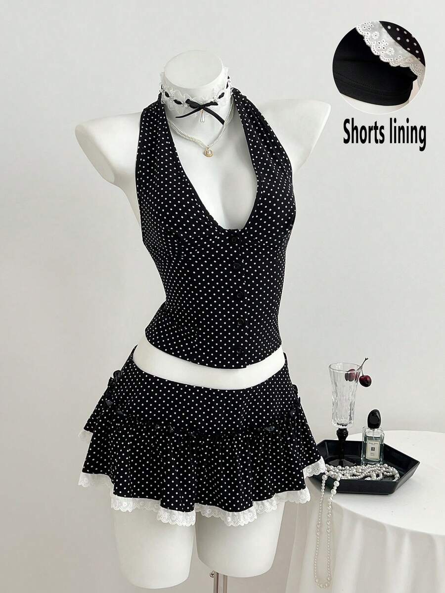 Elamini Bộ đồ gồm áo vest không tay cổ chữ V buộc dây phía sau in chấm bi đen và chân váy ngắn cạp thấp xếp ly, kết hợp với quần legging viền ren tương phản, kiểu dáng thanh lịch cổ điển, thoải mái, phù hợp đi làm, đi học, đa năng cho mùa xuân/hè. - màu đen - Xem 1