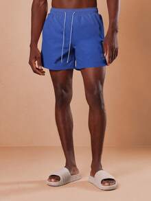 SUMWON 常规版型沙滩泳裤，弧形裤脚和抽绳设计，适合夏季游泳池度假休闲沙滩装穿着，纯色 - 藍色 - 查看 5