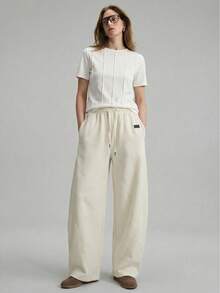 Ontre 2026春夏女装梭织条纹浪漫情人节杏色喇叭裤，宽松版型，适合独立日、都市时尚、简约通勤穿着。 - 杏色 - 查看 1