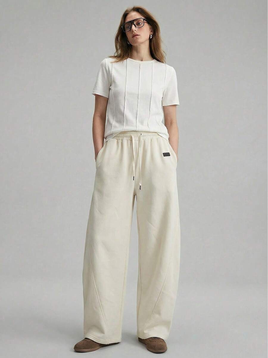 Ontre 2026春夏女装梭织条纹浪漫情人节杏色喇叭裤，宽松版型，适合独立日、都市时尚、简约通勤穿着。 - 杏色 - 查看 1