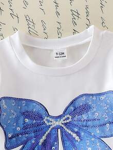 SHEIN Playful Pals Baby Girls' Cute Oversized Bow Print Short Sleeve Round Neck White Top Paired With Blue Shorts,Casual Minimalist Summer T-Shirt Set Vacation Outfits - White - View 5