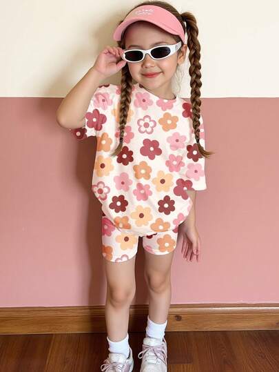 SHEIN Cream White, Cute Sweet Dopamine Pink Floral Print, Young Girl Casual Comfortable Soft Loose Round Neck Short Sleeve T-Shirt And Skinny Bike Shorts Set, Suitable For Spring/Summer Daily, Home, Vacation, Holidays, Spring Vibes, Summer Vibes, Spring & Summer Outfits, Easy Comfort, Stylish Little Girl Set, Casual Wear, Kids Floral Graphic Clothes, Spring & Summer Set, New Style