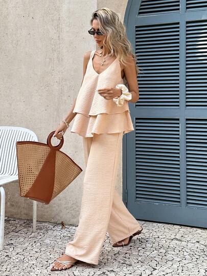 SHEIN Frenchy Conjunto de pantalones anchos y blusa con volantes en el bajo, de unicolor, para vacaciones informales