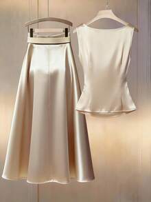 Franclia 女士香槟色优雅V领无袖衬衫，蘑菇纽扣设计，缎面面料，适合通勤和日常穿着；女士缎面A字裙，宽松夏季两件套；女士优雅高贵两件套；米色两件套；正式两件套；金色两件套；女士休闲套装；正式套装；优雅两件套；缎面连衣裙；优雅香槟色正式礼服；丝绸连衣裙；奢华连衣裙；优雅两件套；缎面两件套；香槟色两件套；缎面半身裙；女士两件套；女士度假套装；女士套装；缎面套装；正式两件套。 - 香檳色 - 查看 2