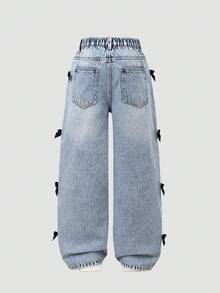 SHEIN Quần jeans ống loe rách rưới phong cách vintage dành cho bé gái tuổi teen, có đường xẻ tà phía trước và nơ 3D, kiểu dáng casual đa năng, phù hợp cho mọi mùa. - Rửa trung bình - Xem 2