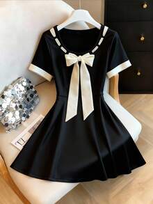 GlowEve 女士蝴蝶结短袖A字休闲连衣裙 - 黑色 - 查看 1