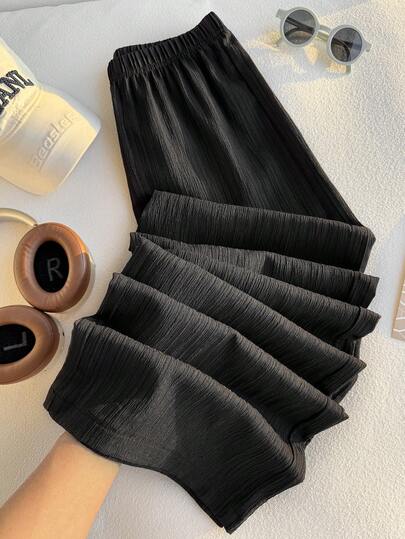 Para adolescentes (14-16 años): Pantalones casuales de pierna ancha. Estos pantalones presentan un diseño de textura arrugada vertical, elaborados en tela ligera y sin forro polar que ofrece un ajuste suave y fluido. Proporcionan un estilo relajado y holgado que es suelto y favorecedor de la figura, perfecto para salidas diarias, estar en casa y desplazamientos casuales. Ideal para el verano.