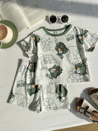 SHEIN 2 piezas Conjunto de pijama de verano casual con estampado de dinosaurio de dibujos animados y bloques de color para niño bebé