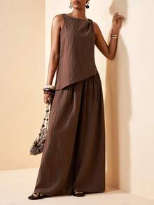 Zivah Bộ đồ hai mảnh màu nâu mới cho mùa Xuân/Hè 2026, gồm áo kiểu dáng rộng rãi, chất liệu vải có họa tiết, thắt nút ở vai và quần ống rộng cạp cao. Thích hợp cho mặc hàng ngày, đi nghỉ mát, phong cách boho, đi biển, dự tiệc, trang phục dự đám cưới, trang phục sân bay, mặc đi ăn trưa, đi làm, du lịch, kỳ nghỉ, trà chiều và mua sắm. - màu nâu - Xem 5