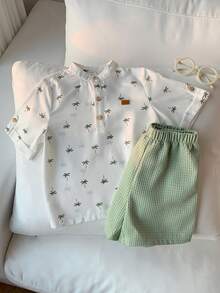 SHEIN 2pcs/Set Young Boy Cartoon Coconut Tree Pattern Mandarin Collar Short Sleeve Half-Zip Pullover Top And Elastic Waist Solid Color Shorts,Kids - White - View 4