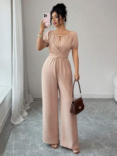 Rafferiza Elegant Khaki Jumpsuit For Women, Featuring A Round Neck, Knotted Waist, And Wide-Leg Design With Wooden Bead Embellishments. This Long Summer Jumpsuit Is Perfect For Women's Holidays, With Vintage Wooden Bead Details, Puff Sleeves, Knotted Straps, And Textured, Pleated Fabric.