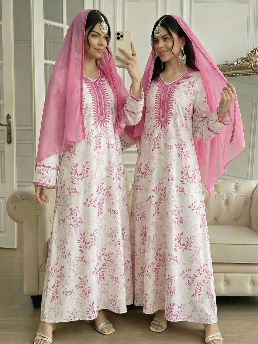 Đây là một chiếc váy dài được thiết kế dành cho các cô gái tuổi teen. Váy có kiểu dáng rộng rãi, tay dài, họa tiết lá cây trải khắp thân váy, cùng với các họa tiết thêu ở cổ áo và tay áo. Đây là một chiếc váy truyền thống phù hợp cho mùa xuân và mùa hè. - Nhiều màu - Xem 1