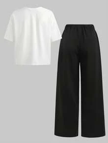 SHEIN Bộ 2 món màu đen trắng dành cho nữ tuổi teen, gồm áo thun cổ tròn dáng ngắn in chữ tiếng Anh và quần ống rộng. - Đen và trắng - Xem 2