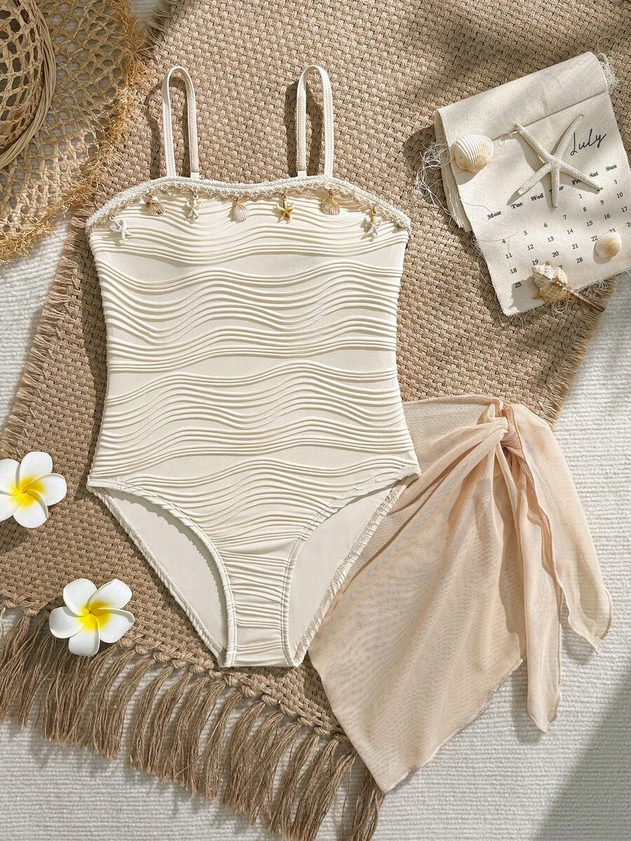 SHEIN 少女白色连体夏季沙滩度假泳衣,采用纹理面料、网纱裙摆和贝壳图案,荷叶边设计,适合青少年和泳池穿着。 - 杏色 - 查看 1