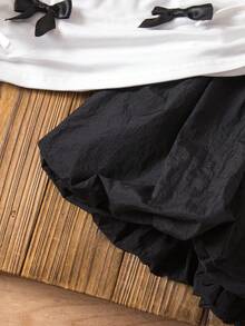 SHEIN 2pcs Baby Girl Cute Knit Bow Tie Short Sleeve T-Shirt & Elastic Waist Black Skirt Set - Black and White - View 7