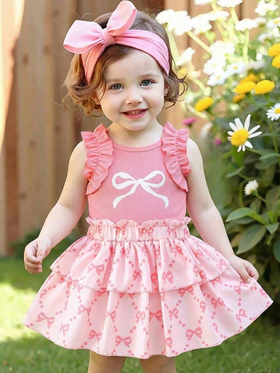 1 set Top à manches courtes avec volants et imprimé nœud et jupe à volants pour bébé fille. Style mignon et girly. Ensemble léger et respirant de 2 pièces adorable pour les sorties quotidiennes et les jeux. Tenue de mode printemps et été - Vieux Rose - Voir 1
