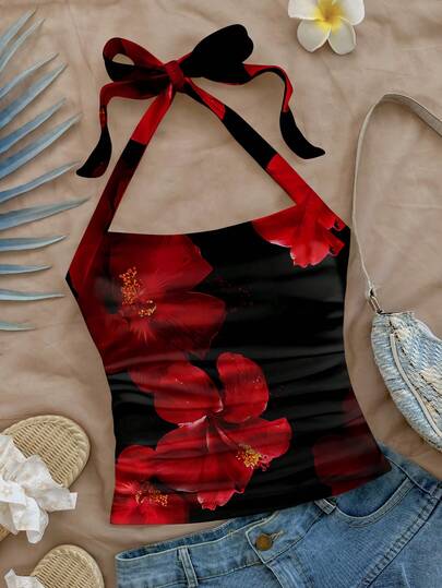 Soleia Damsemesterlinne med halterneck, svart och rött, kontrasterande blommönster, stickat och texturerat, passande för sommar, utomhus, strand, resor, elegant