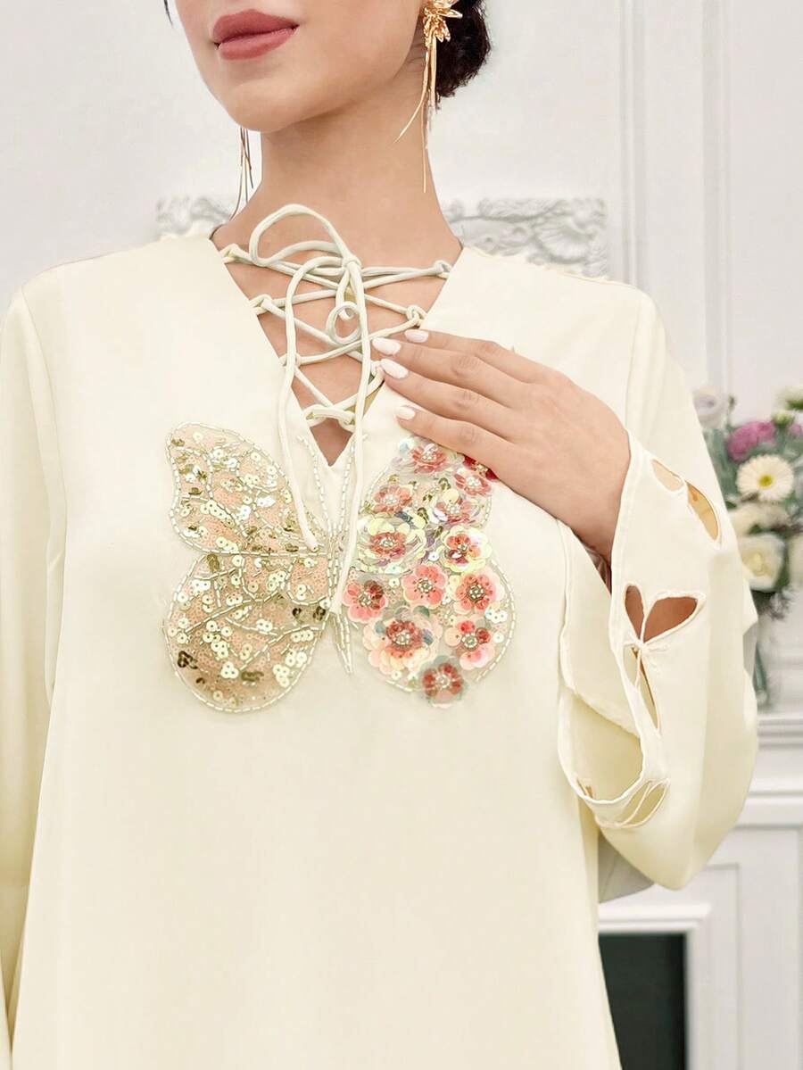 Yasmyna رمضان فستان أنيق بأكمام طويلة وياقة ربطة عنق مزين بترتر على شكل فراشة بطراز عربي - لون مشمشي - مشاهدة 1