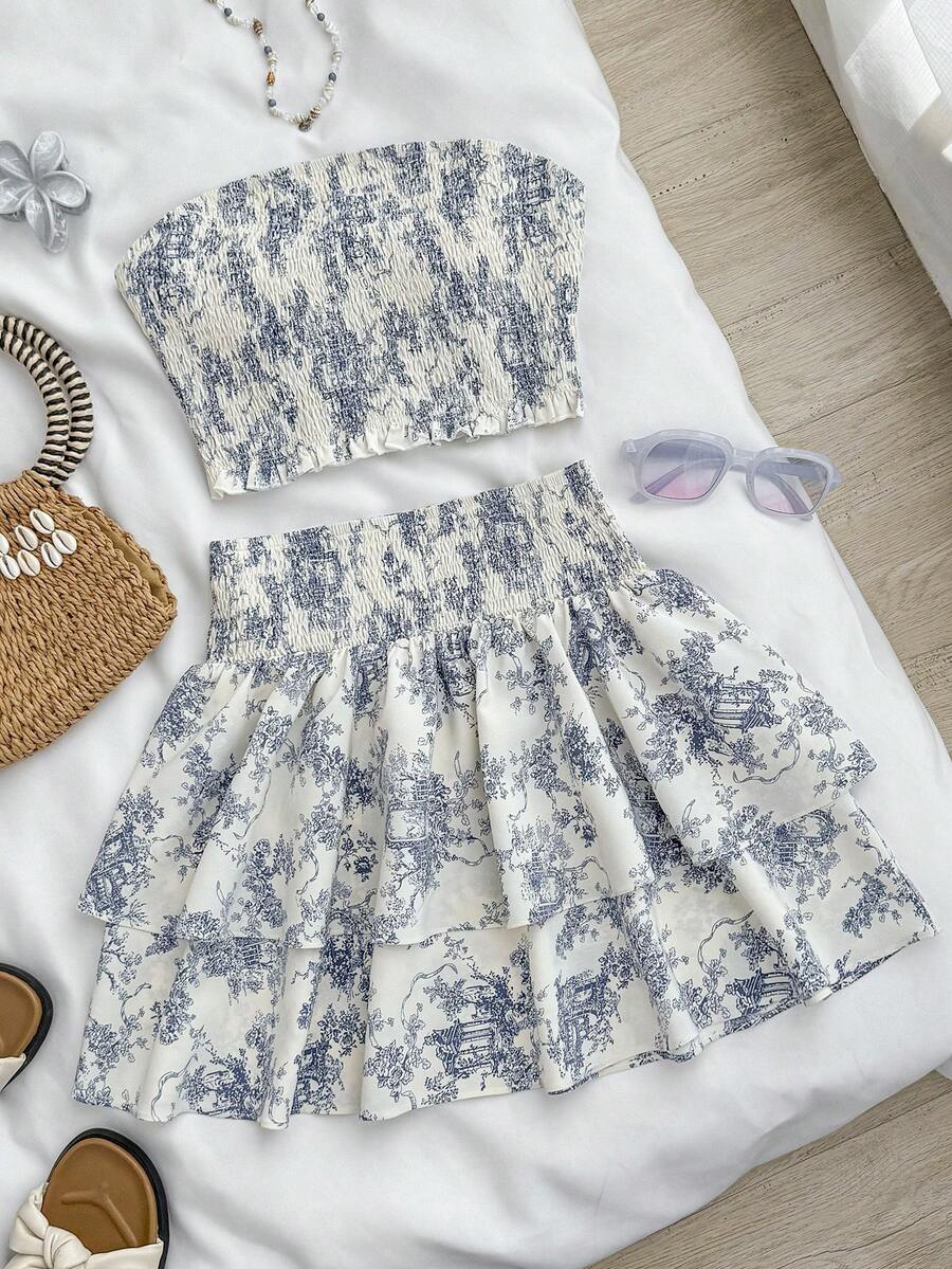 SHEIN Kids Summer Outfits  Squishy Teen Girls Landscape Painting Blue & White Print Tube Top Woven Tight Cropped Camisole Top With High Waist Layered Ruffle Hem Cake Skirt Vacation Casual Outfit Set Two Piece Set Summer Teen Skirt Two Piece Set Linen Two Piece Set Girls Dress Two Piece Preppy Two Piece Set - Blue and White - View 1