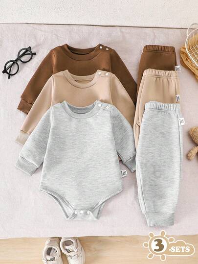 SHEIN Vintaside Kids 3件套男婴圆领长袖纯色连体衣套装，黑、白、灰三色可选，时尚款式，简约纯色图案设计，打造高级造型，宽松版型适合不同体型。3件套包含一件连体衣上衣和3条无腰带长裤，适合各种场合：适合户外玩耍，轻松自由；适合居家休闲，舒适惬意；适合运动，灵活活跃；