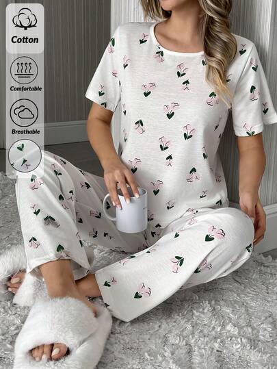 SHEIN Conjunto de pijama feminino plus size de algodão, 2 peças, blusa de manga curta com gola redonda e estampa floral delicada, calça comprida, ideal para usar em casa. Confortável e ideal para usar em casa.